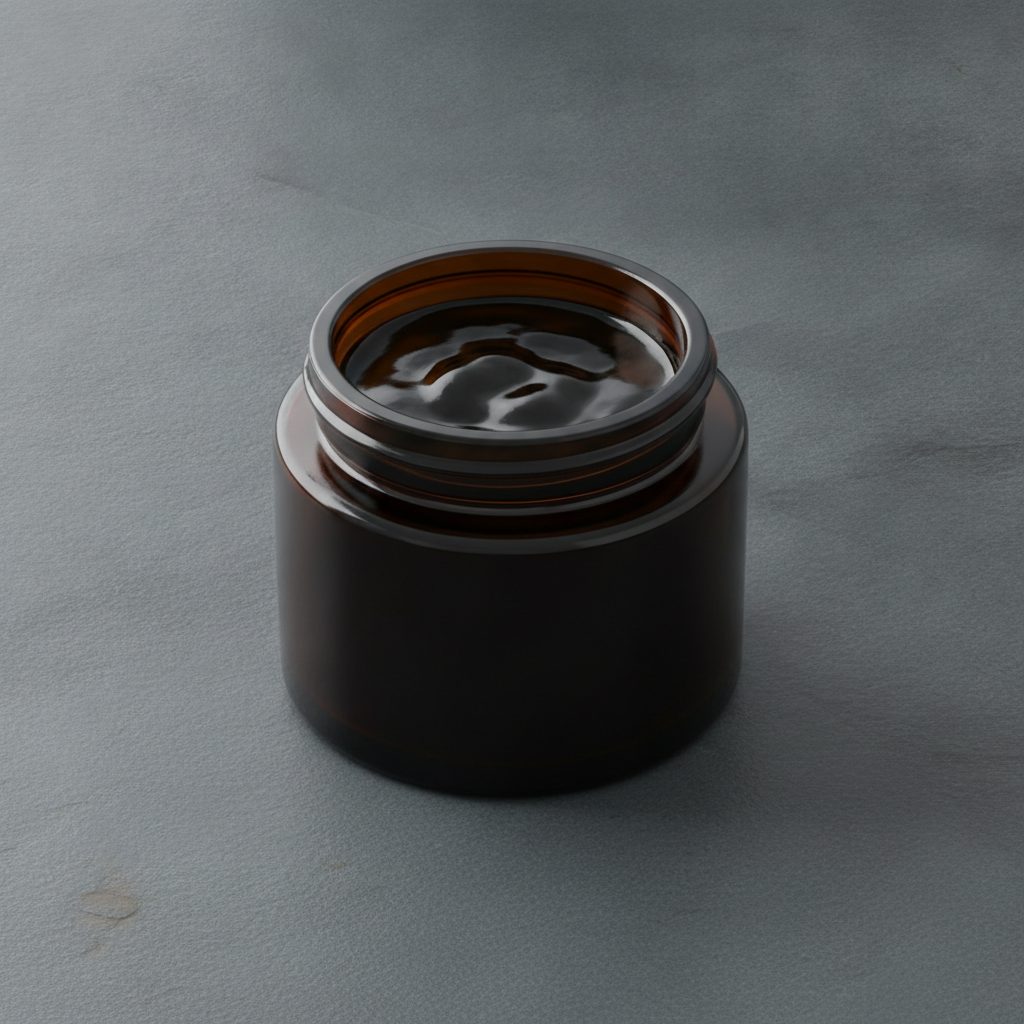 Unbranded dark shilajit resin jar on stone, header for the shilajit brand reviews